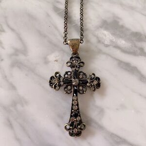 Black cross necklace.